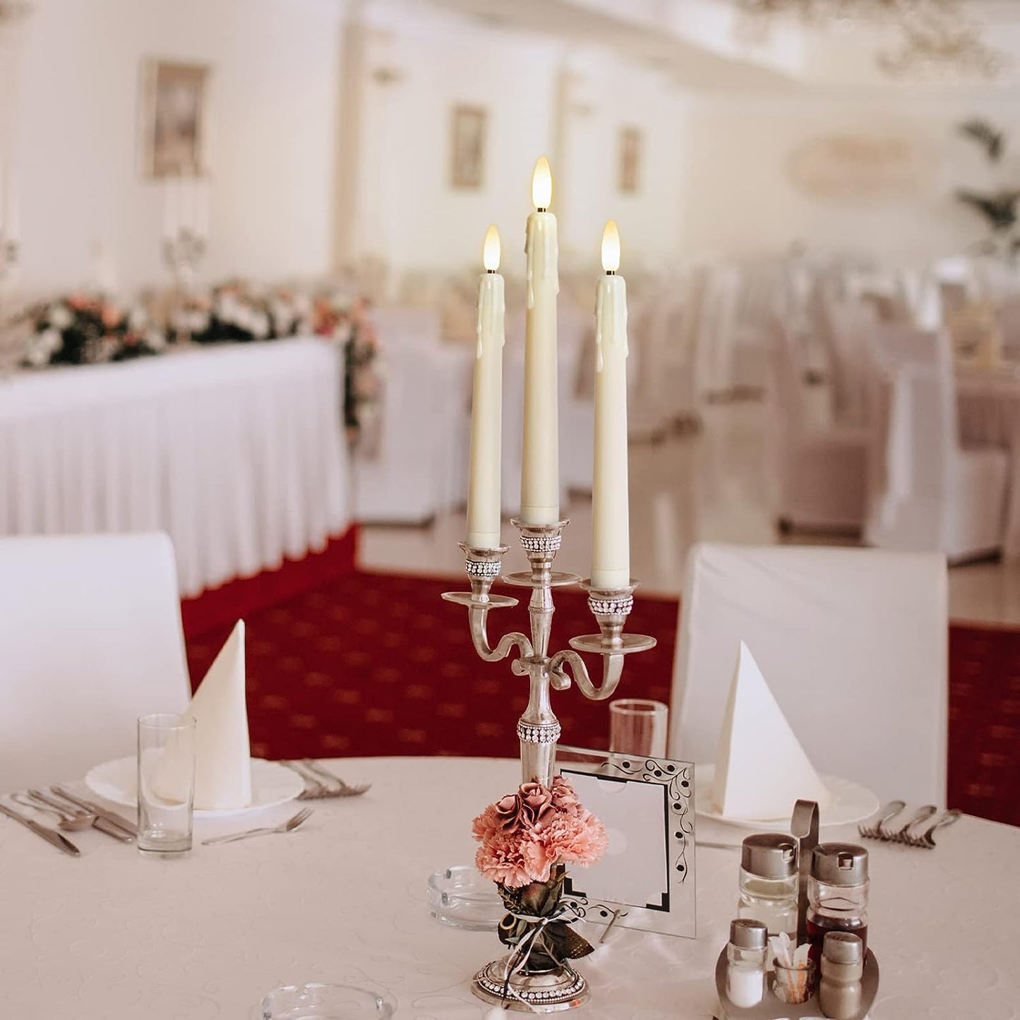 4 Pack Battery Operated LED Window Candles - These 8-inch Ivory Flameless Taper Flickering Candles come with removable Black Candlesticks and Suction Cups. They include a Remote Timer and are perfect for holiday and home decor.