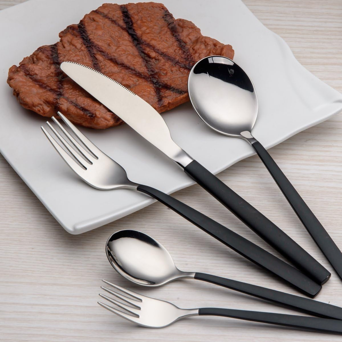 Black and Silver 20-Piece Titanium Black Plated Stainless Steel Flatware Set - Featuring Black Handles with Silver Mouth, Providing an Elegant Black and Silver Cutlery Set for Service for 4.