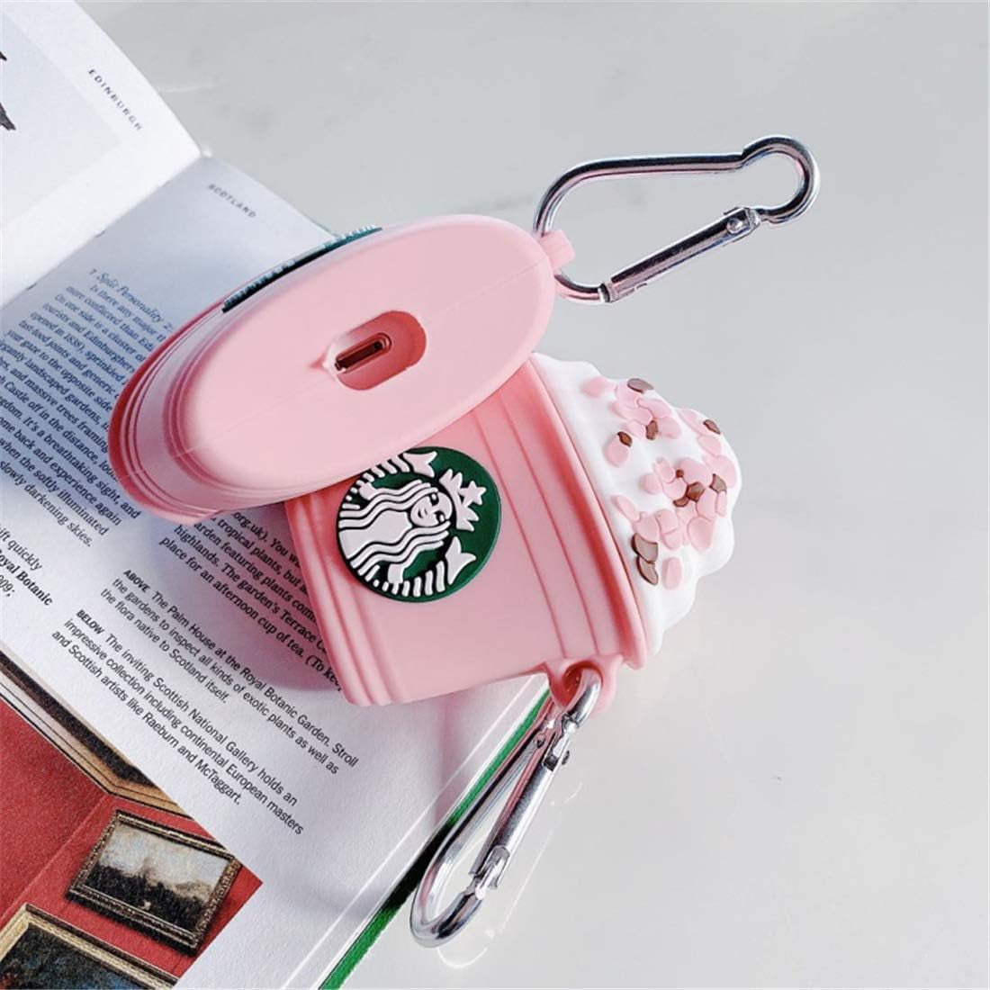 Pink coffee cup silicone AirPods case with 3D character design and keychain.