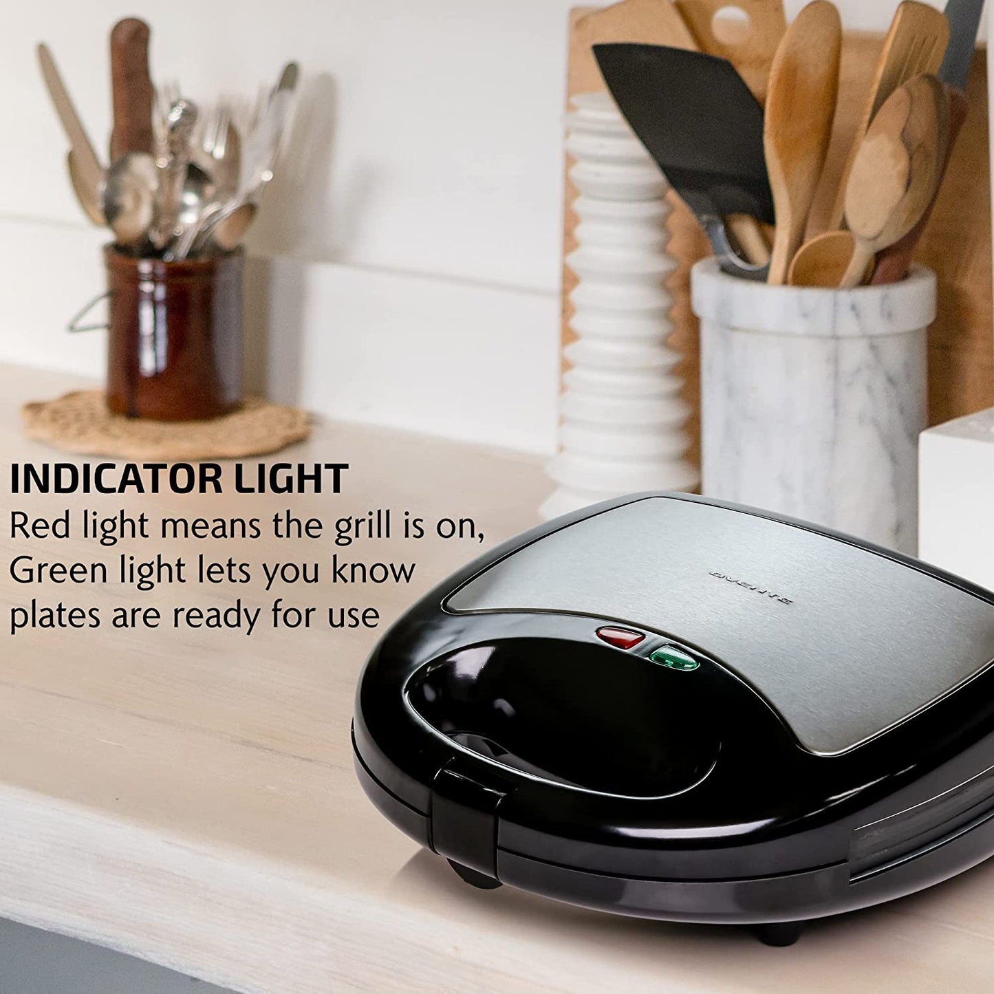 3-in-1 Electric Sandwich Maker: Features Detachable Non-Stick Waffle and Grill Plates. Operates at 750-Watts and includes LED Indicator Lights, Cool Touch Handle, and Anti-Skid Feet for safety and convenience.