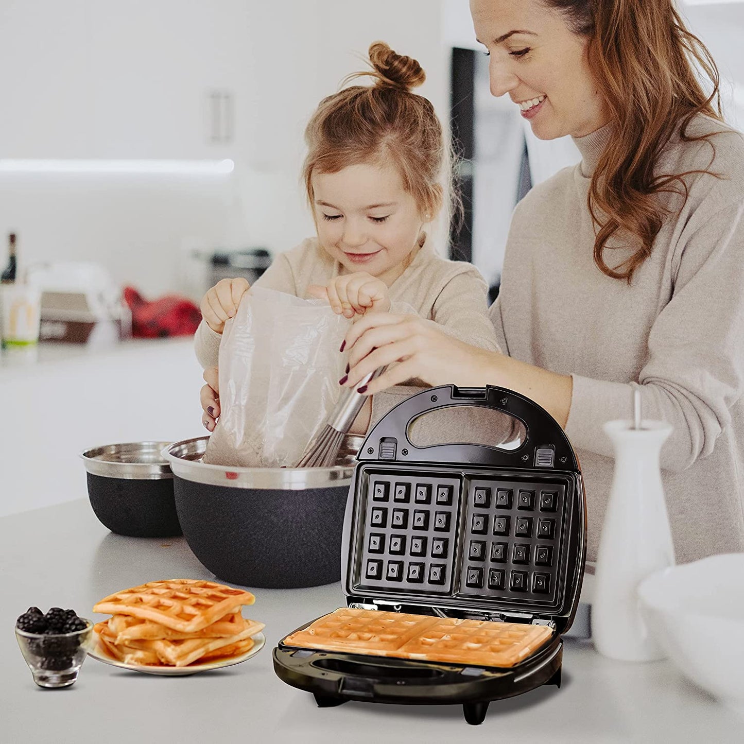 3-in-1 Electric Sandwich Maker: Features Detachable Non-Stick Waffle and Grill Plates. Operates at 750-Watts and includes LED Indicator Lights, Cool Touch Handle, and Anti-Skid Feet for safety and convenience.