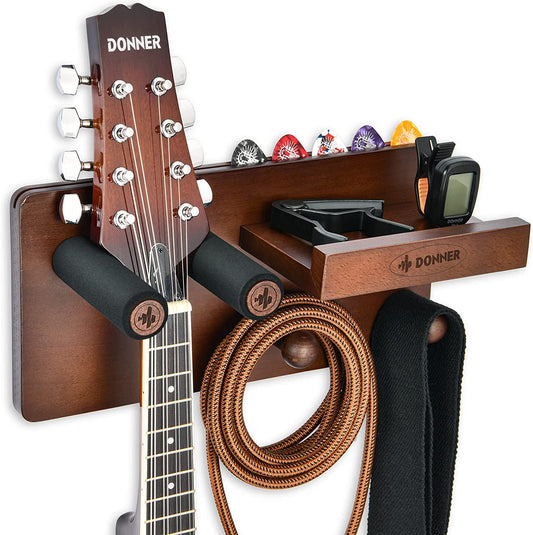 Guitar Wall Mount Shelf - This Guitar Wall Hanger comes with a Storage Shelf, Pick Holder, and 2 Hooks. It's designed for securely hanging Electric Guitars, Acoustic Guitars, Bass Guitars, and Guitar Accessories while also providing storage space.