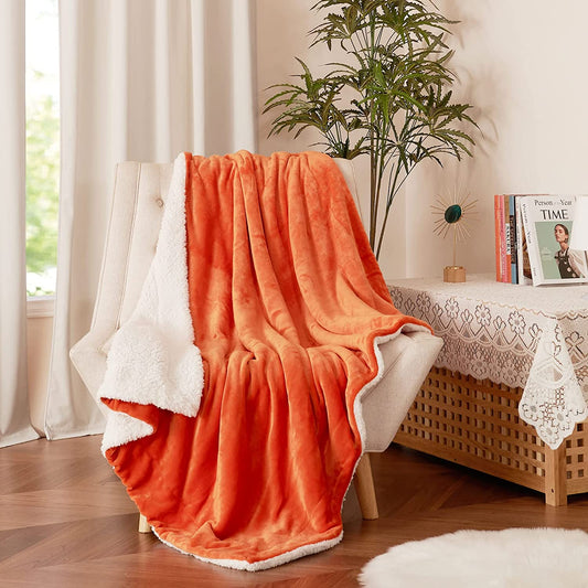Kids Sherpa Fleece Throw Blanket for Couch - A Winter Warm, Fuzzy, and Soft Blanket measuring 50 inches x 60 inches. It's Velvet Reversible and offers a Luxurious feel. Ideal for home, bed, and school use, and comes in an attractive Orange color.